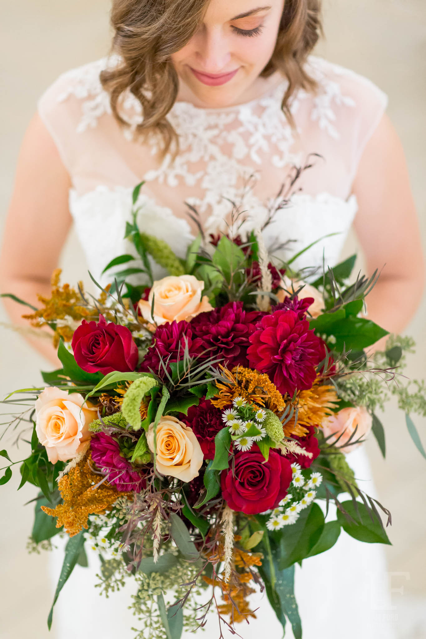A bride with stunning natural makeup and beautiful wedding bouquet