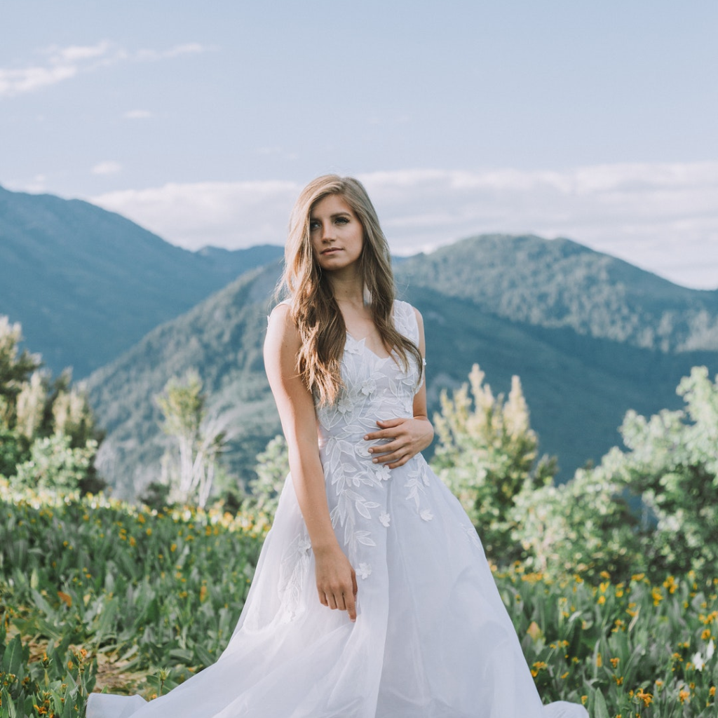 Bride with green and mountain scenery